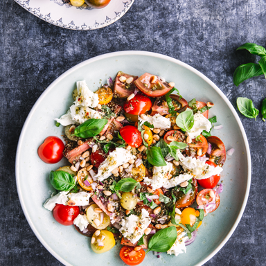 Earth-Control-Colourful-tomato-salad-with-pine-nuts-and-fresh-mozzarella.png